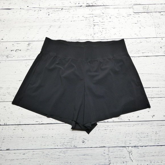 Athleta Pants - Athleta Shorts Womens Medium Black Cosmic Flutter Short Running Athletic Pockets